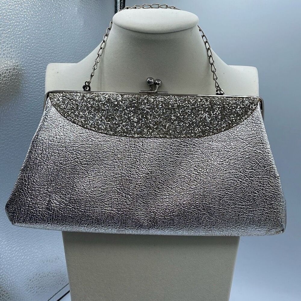 Vintage mid century silver foil clutch with silver cut stones .